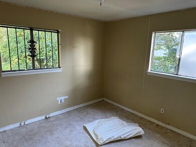 Unfurnished room featuring a wealth of natural lig