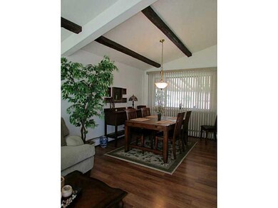 Dining Room. Beamed, cathedral ceilings continue f