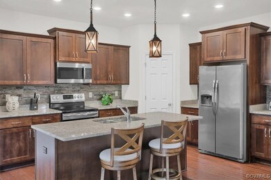 Kitchen featuring pendant lighting, dark hardwood