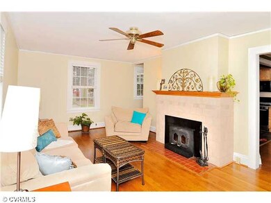 Living Room - Enter into your spacious living room with hardwood floors and fireplace
