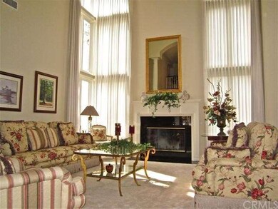 Spacious formal living room under a soaring ceilin