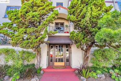 Entrance to property featuring stucco siding and french doors