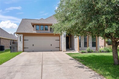 View of front of property with a shingled roof, a