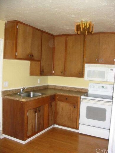 Kitchen-The stove, microwave, and refrigerator are