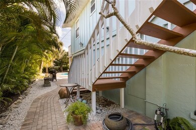 Paved walkway to the stairs and also backyard oasi