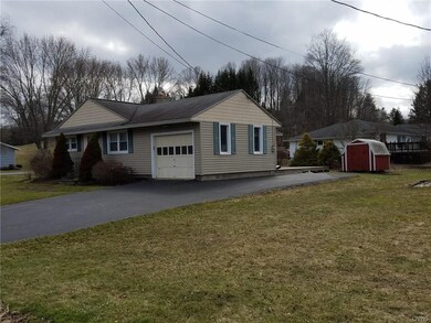 Front view with garage and showing double wide dri