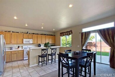 Enormous and bright kitchen is wide open to dining