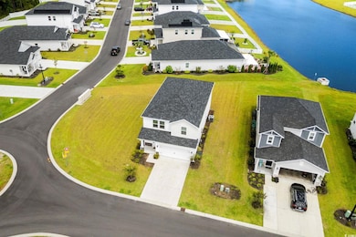 Aerial view of residential area with a large body of water