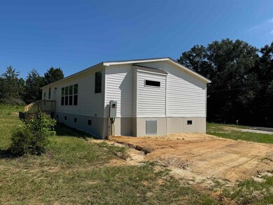 View of side of property featuring crawl space
