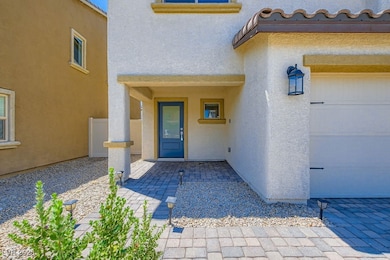 Entrance to property with stucco siding