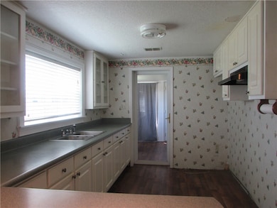 The large kitchen opens toward the living room.