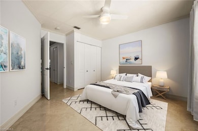 Bedroom featuring visible vents, a closet, crown m