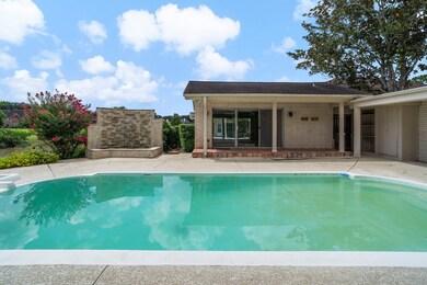 A separate pool house includes a full bathroom – i