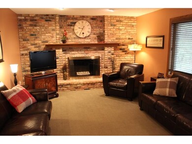 Cozy up in the main floor family room right off th