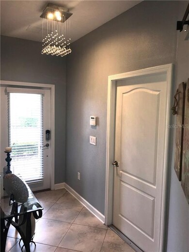 Foyer with glass front door and garage door