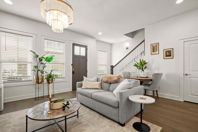 Living area with stairs, wood finished floors, re