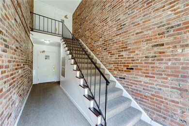 Entry of building. Go up the stairs to unit G