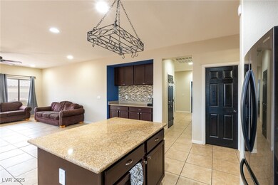 Kitchen featuring a center island, decorative back