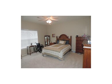 Huge master bedroom with ceiling fan, walk in clos