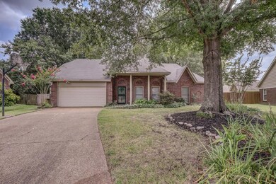 View of front of property with a garage and a fron