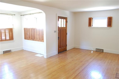 Lower apt. living rm with hardwood and extra space