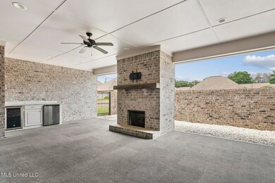 Outdoor Living Room and Kitchen with F/P