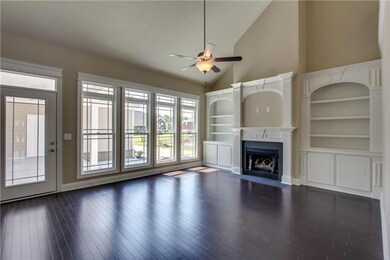Great Room with TONS of Natual Sunlight, Built In Bookcases, Fireplace and More!