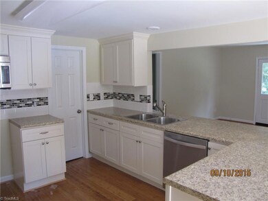 Plenty of workspace in this Kitchen. Hardwoods continue.