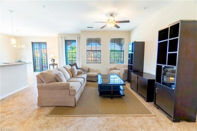 Living area with visible vents, baseboards, light 