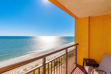 Balcony featuring a water view and a view of the b