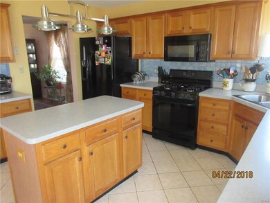 Open kitchen from family room, lots of cabinets, c