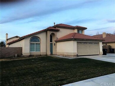 FRONT VIEW OF THE HOUSE WITH NICE LAWN