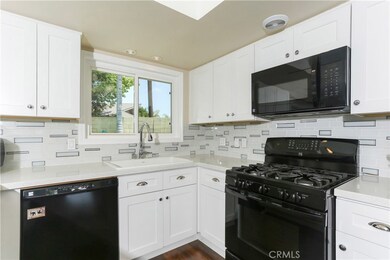 Beautiful glass style mossiac backsplash gives this recently remodeled kitchen a nice touch!