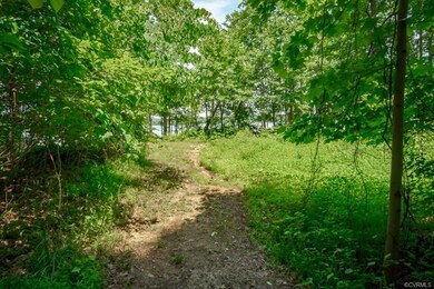 Path behind the house which leads to the water.  T