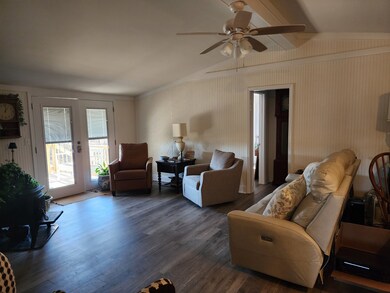 Large living room with new flooring and paint.