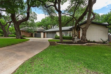 View of front of house with concrete driveway, br
