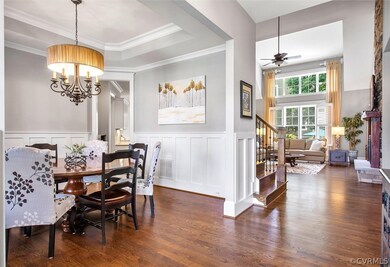 Dining room wainscotting, tray ceiling, chandelier