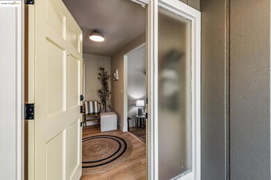 Hallway featuring wood finished floors