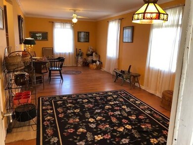 large living room & dining room combined with access to screened porch, kitchen, & front hall