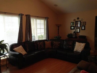 Second view of the living room. Note the wood lami