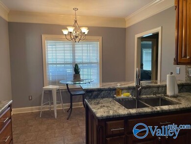 Kitchen view with bar eating area and breakfast area