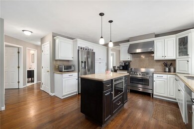 Kitchen with island and stainless appliances