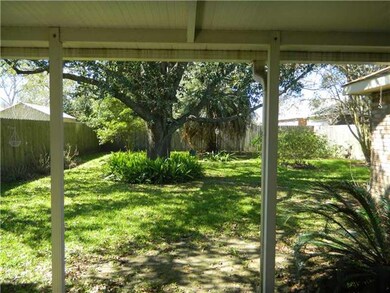 Backyard. REAR YARD VIEW FROM COVERED PATIO OF TRA
