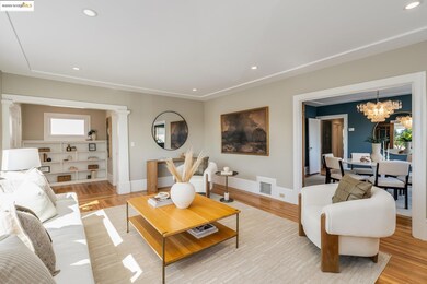 Living room featuring a chandelier, recessed lighting, and light wood-style floors