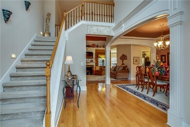 Wow! This is what you, your family and all your guests walk into-this glamorous sitting! Open floor plan allows you to see the welcoming foyer, formal dining area, living room and out into the backyard.  