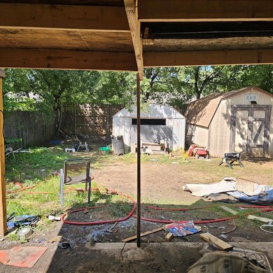 View of yard featuring a storage unit