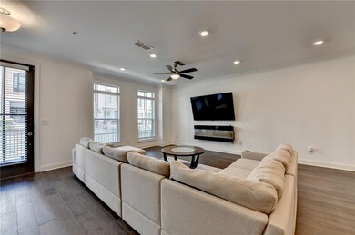 Living room featuring crown molding, dark wood finished floors, ceiling fan, and recessed lighting