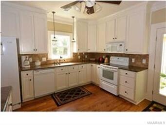Closer View of Kitchen and View of Window Outside 