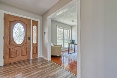 Foyer area is spacious and welcoming, opening to the home office, formal dining and family rooms