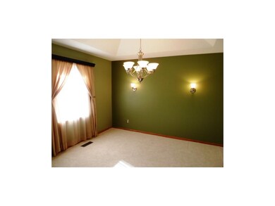 Dining room with updated lighting, wall sconces & 